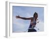 Male Runner Victorious at the Finish Line in a Track Race-null-Framed Photographic Print