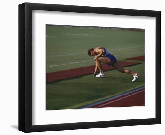 Male Runners Stetching before Competing in a Track Race-null-Framed Photographic Print