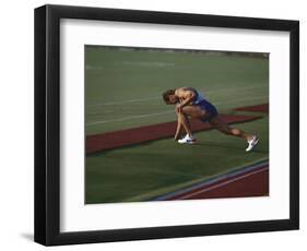 Male Runners Stetching before Competing in a Track Race-null-Framed Photographic Print