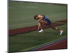 Male Runners Stetching before Competing in a Track Race-null-Mounted Photographic Print