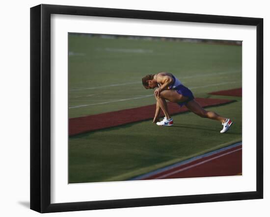 Male Runners Stetching before Competing in a Track Race-null-Framed Photographic Print