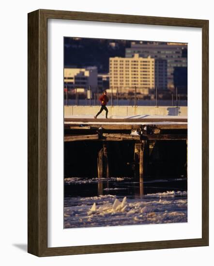 Male Running in Snow Through the City, New York, New York, USA-null-Framed Photographic Print