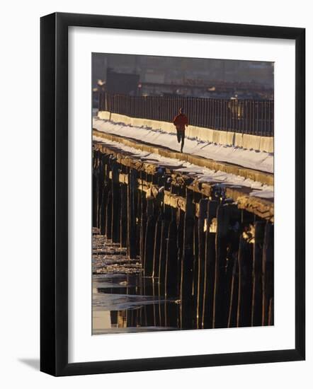 Male Running in Snow Through the City, New York, New York, USA-null-Framed Photographic Print