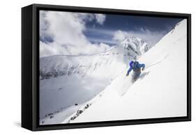 Male Skier Above The Pinnacles With Lone Peak In The Background Big Sky Resort, Montana-Ryan Krueger-Framed Stretched Canvas