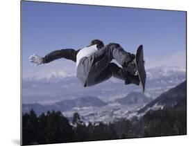 Male Snowboarder Flying over the Vert-null-Mounted Photographic Print