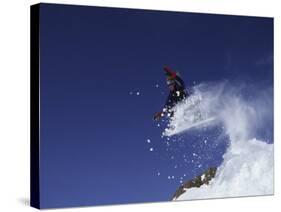 Male Snowboarder Flying Through the Air-null-Stretched Canvas