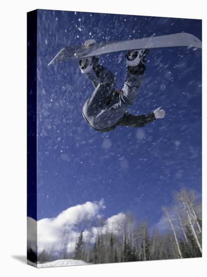 Male Snowboarder Flying Throught the Air, Aspen, Colorado, USA-null-Stretched Canvas