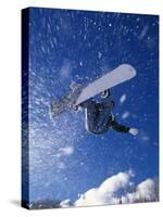 Male Snowboarder Flying Throught the Air-null-Stretched Canvas
