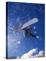 Male Snowboarder Flying Throught the Air-null-Stretched Canvas