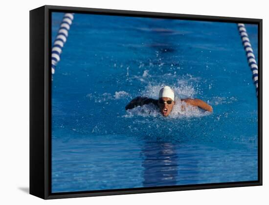 Male Swimmer Competing in a Butterfly Race-null-Framed Stretched Canvas