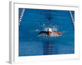 Male Swimmer Competing in a Butterfly Race-null-Framed Photographic Print