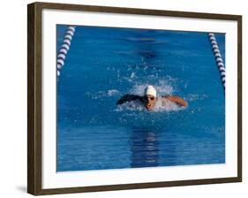 Male Swimmer Competing in a Butterfly Race-null-Framed Photographic Print