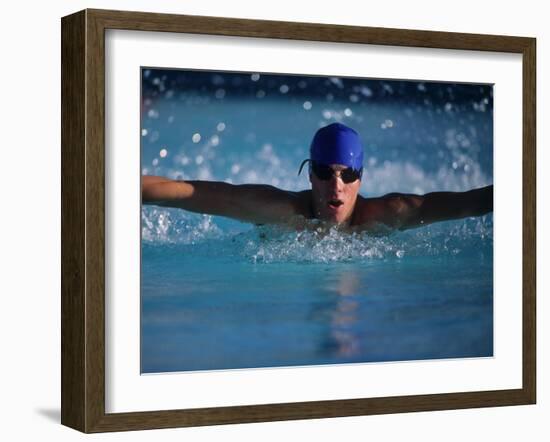 Male Swimmer Competing in Abutterfly Race-null-Framed Photographic Print