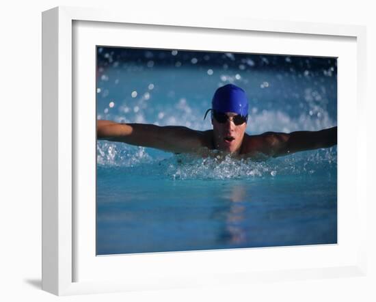 Male Swimmer Competing in Abutterfly Race-null-Framed Photographic Print