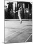 Male Tennis Player Jumping for Shot-null-Mounted Photo