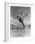 Male Tennis Player Jumping over Net-null-Framed Photo