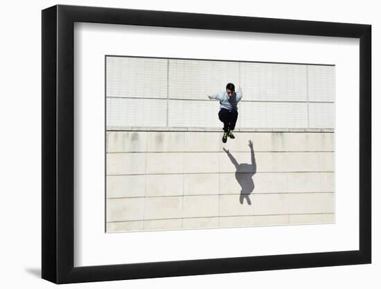 Male Tracer Free Runner Jumping Forward from High Rooftop over Cement Building Background, Young Tr-GaudiLab-Framed Photographic Print