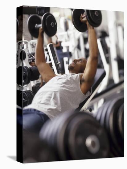 Male Working Out with Weights in a Health Club, Rutland, Vermont, USA-Chris Trotman-Stretched Canvas