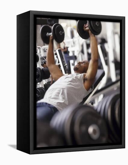 Male Working Out with Weights in a Health Club, Rutland, Vermont, USA-Chris Trotman-Framed Stretched Canvas