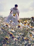 A Woman in a White Victorian Dress, Walking Among Camomile Flowers on a Meadow on a Sunny Day-Malgorzata Maj-Framed Photographic Print