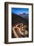 Maloja pass, Graubunden canton, Switzerland. Cars light up the bending mountain road heading to the-Marco Bottigelli-Framed Photographic Print