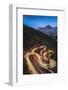 Maloja pass, Graubunden canton, Switzerland. Cars light up the bending mountain road heading to the-Marco Bottigelli-Framed Photographic Print