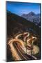 Maloja pass, Graubunden canton, Switzerland. Cars light up the bending mountain road heading to the-Marco Bottigelli-Mounted Photographic Print