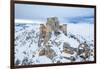 Man admiring the snowy medieval castle of Rocca Calascio after heavy snowfall, Rocca Calascio-Paolo Graziosi-Framed Photographic Print