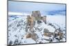 Man admiring the snowy medieval castle of Rocca Calascio after heavy snowfall, Rocca Calascio-Paolo Graziosi-Mounted Photographic Print