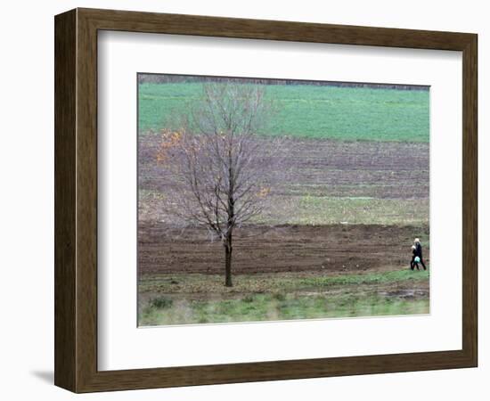 Man and Child Pass Through the Former Location of the Amish School in Nickel Mines, Pennsylvania-null-Framed Photographic Print