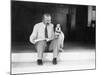Man and Dog Sitting on the Steps Reading the Newspaper-null-Mounted Photo