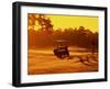 Man and Golf Cart Silhouetted at Sunset-Bill Bachmann-Framed Premium Photographic Print