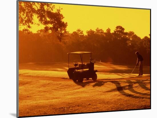 Man and Golf Cart Silhouetted at Sunset-Bill Bachmann-Mounted Premium Photographic Print