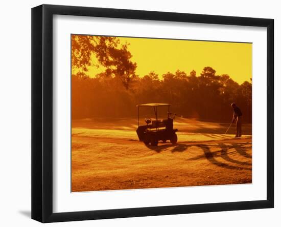 Man and Golf Cart Silhouetted at Sunset-Bill Bachmann-Framed Photographic Print