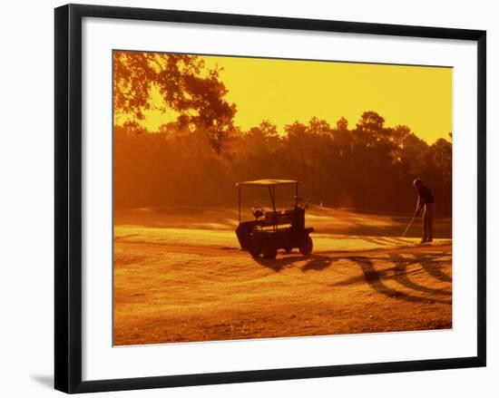 Man and Golf Cart Silhouetted at Sunset-Bill Bachmann-Framed Photographic Print