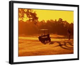 Man and Golf Cart Silhouetted at Sunset-Bill Bachmann-Framed Photographic Print