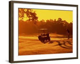 Man and Golf Cart Silhouetted at Sunset-Bill Bachmann-Framed Photographic Print