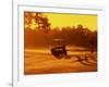 Man and Golf Cart Silhouetted at Sunset-Bill Bachmann-Framed Photographic Print