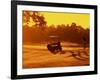 Man and Golf Cart Silhouetted at Sunset-Bill Bachmann-Framed Photographic Print