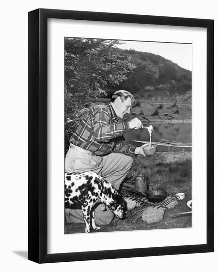 Man and His Dog Camping and Preparing Food-null-Framed Photo