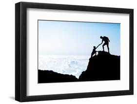 Man and Woman Help Silhouette in Mountains-blas-Framed Photographic Print