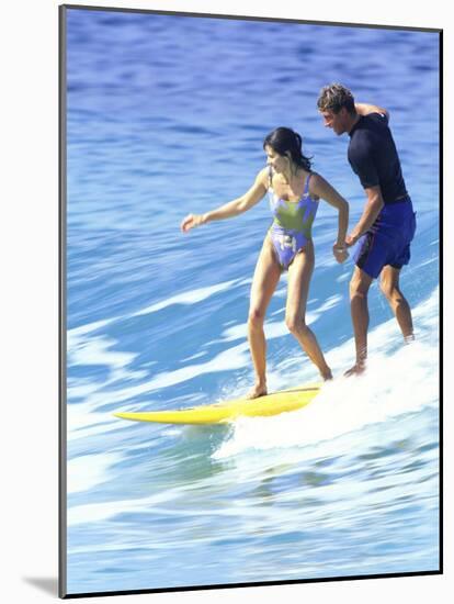 Man and Woman on a Surfboard-null-Mounted Photographic Print