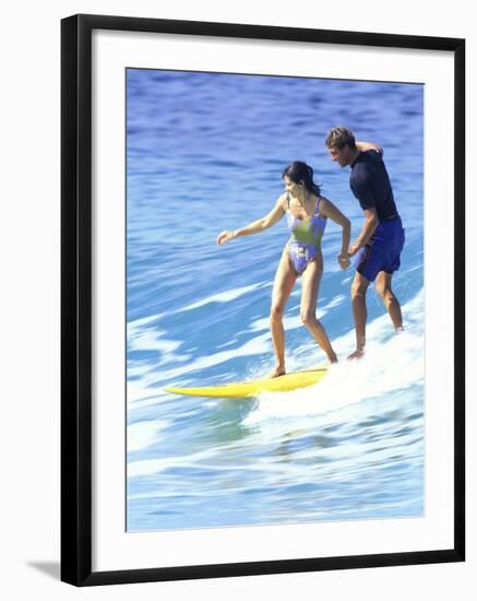 Man and Woman on a Surfboard-null-Framed Photographic Print