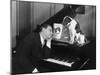 Man Asleep at Piano with Dog-null-Mounted Photo