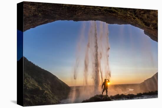 Man Behind Seljalandsfoss Waterfall, Suourland (South Iceland), Iceland-Peter Adams-Stretched Canvas