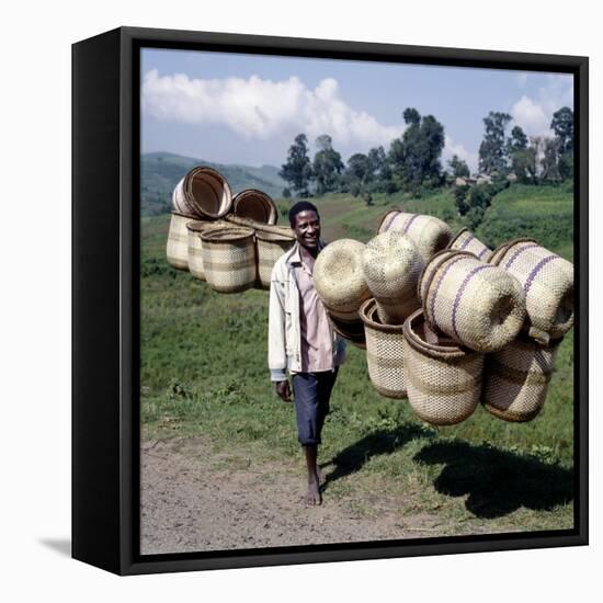 Man Carries Traditional Split-Bamboo Baskets to Sell at Kisoro Market, Southwest Uganda-Nigel Pavitt-Framed Stretched Canvas