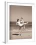 Man Carrying Woman on Beach-Philip Gendreau-Framed Photographic Print