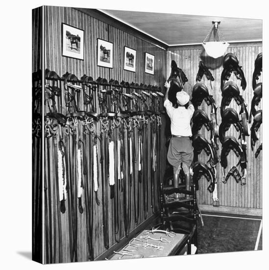 Man Checking Equipment Inside a Stable's Tack Room-Alfred Eisenstaedt-Stretched Canvas