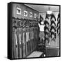 Man Checking Equipment Inside a Stable's Tack Room-Alfred Eisenstaedt-Framed Stretched Canvas