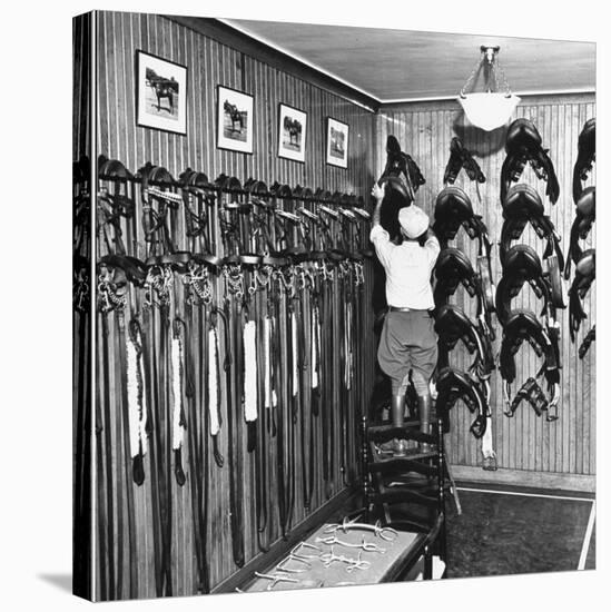 Man Checking Equipment Inside a Stable's Tack Room-Alfred Eisenstaedt-Stretched Canvas